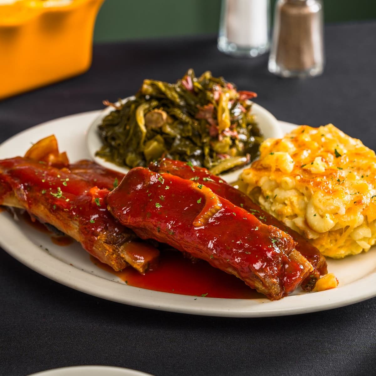 Sylvia’s barbecue pork ribs with macaroni and cheese and collard greens