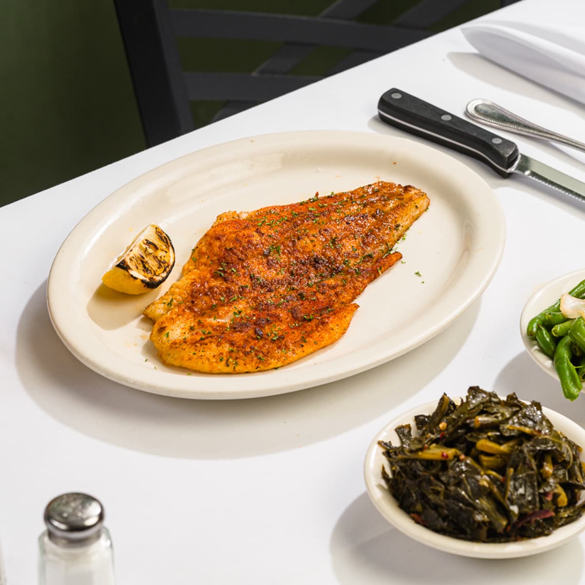 Catfish entrée with collard greens at Sylvia’s
